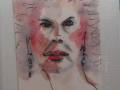 Un retrato abstracto de una mujer con rostro pintado en acuarela, incluyendo detalles como los ojos y la boca. La imagen está firmada con un nombre en el lado derecho.