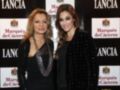 Dos mujeres elegantes posan en un evento de Lancia y Marqués de Cáceres.
