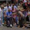 Ortega Cano dado de alta mucho más delgado, pelo corto canoso, agradecido y con un rosario 