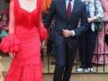 Elegant couple in traditional Spanish attire at a cultural event.